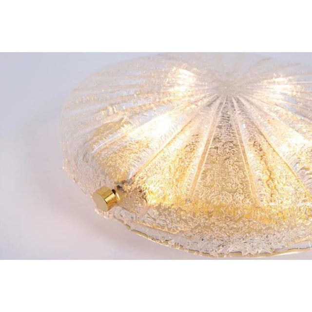 A wonderful round murano flush mount by hillebrand leuchten, germany, 1970s. Thick textured murano fixture on a brass base...