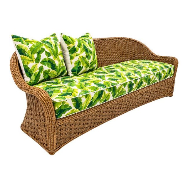 Vintage woven basket-wave style sofa featuring a dramatic sculptural silhouette and freshly custom upholstered cushions in...