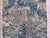 An early 17th-century tapestry depicting a leopard, rabbits, and a goat within a lush verdure landscape. Dimensions: 39 x...