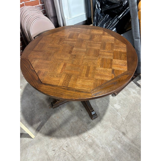 Beautiful oak basketweave top table. 40" round with a unique mechanism to adjust the height to either 26' or 16" .It sits...