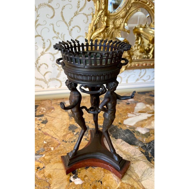 Athenian potpourri in bronze resting on a cherry red marble base. Very decorative, this potpourri is in good condition...