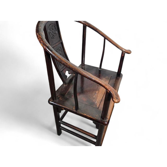 This elegant pair of 19th-century Chinese armchairs dates back to the Qing Dynasty, showcasing traditional craftsmanship...