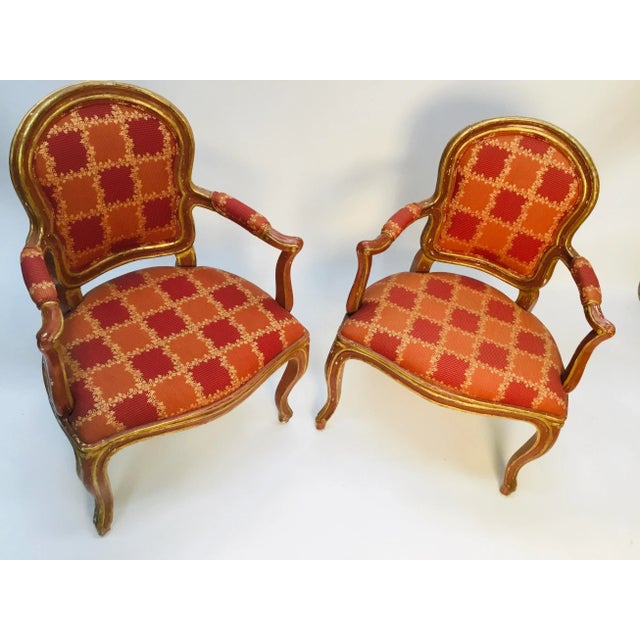 Beautiful pair of late 19th century Lois XV armchairs. Original soft “Venetian red” paint and 23k gold. Elegant lines,...
