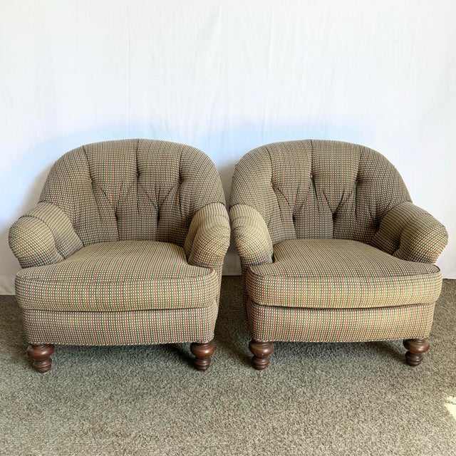 Classic elegance meets cozy comfort in this pair of vintage Regency tufted lounge chairs. Upholstered in a refined red,...