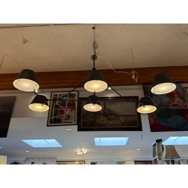 Design Plus Gallery presents the Chiltern Six-Arm Chandelier by The Urban Electric Co. An expansive linear armature...