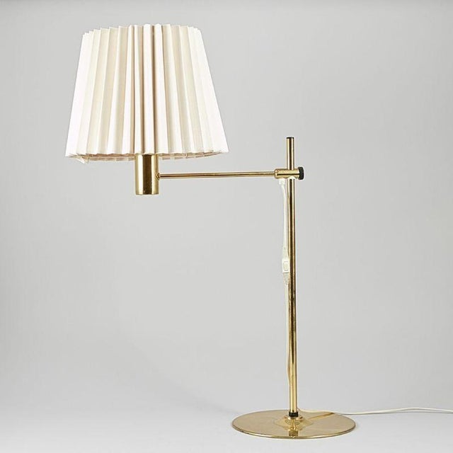 A refined mid-century table lamp designed by Hans-Agne Jakobsson in the 1960s, crafted in Sweden. This elegant piece...