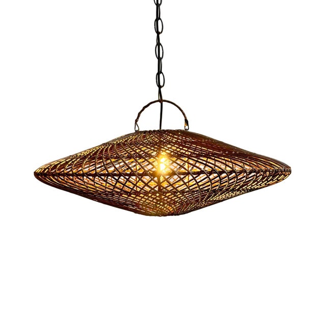 Hand woven coffee stain wicker discus design pendant light. Height measurement includes the 4" handle at top. Each may...