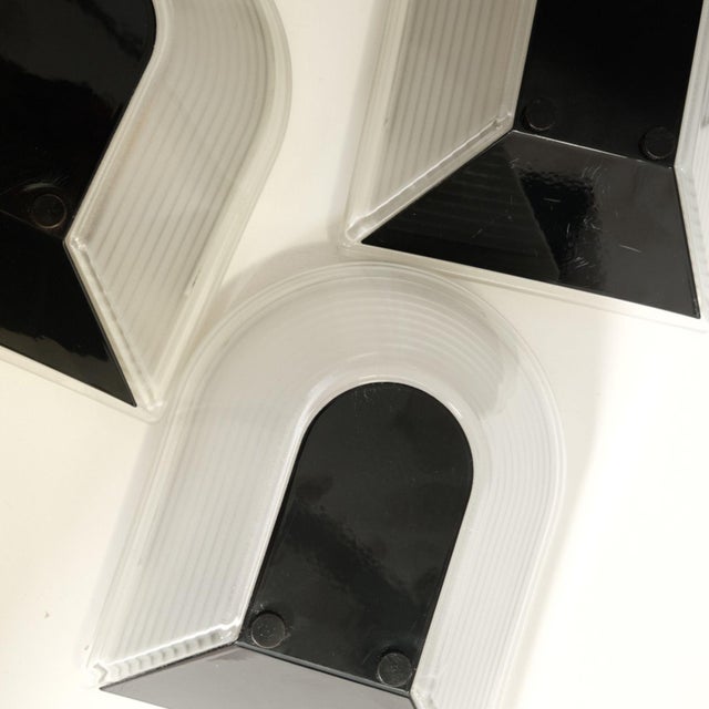 Trio of the iconic Prisma lamps art. Thesis, design attributable to Fiorato. Italian production from the 80s. Hard plastic...