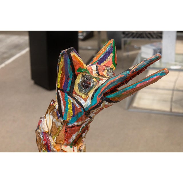 A vibrant and imaginative folk-art sculpture by Detroit artist Willie Leroy Elliot Jr., titled "Wolf Bench". Created circa...