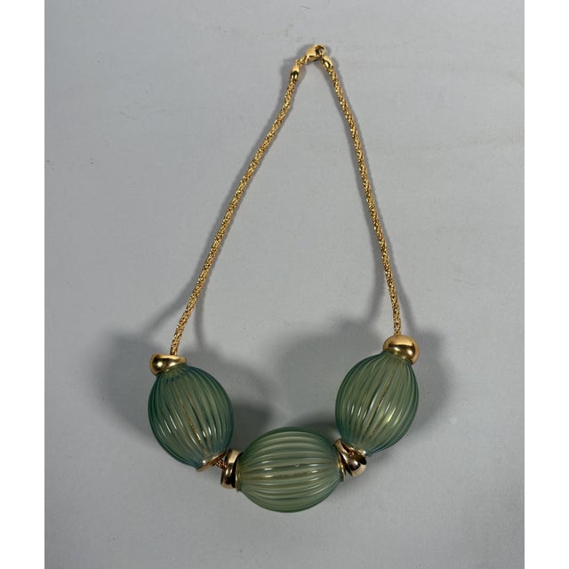 Maison LALIQUE - Marie-Claude LALIQUE "Nerita" Model, created in 1995 Necklace featuring a twisted gold chain adorned with...