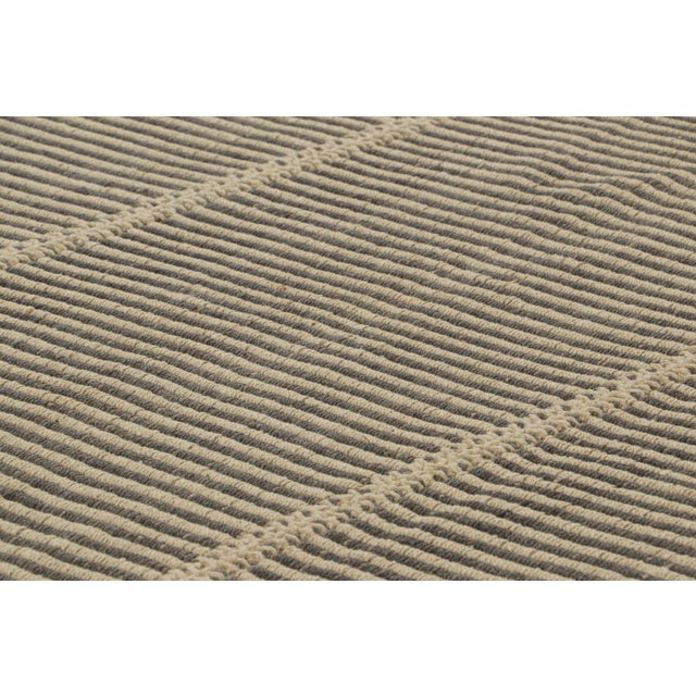 Handwoven in wool, this 9×12 Kilim rug is from an inventive new contemporary flat weave collection by Rug & Kilim. On the...