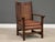 Crafted in the enduring Arts & Crafts tradition, this L. & J.G. Stickley armchair showcases solid quarter-sawn oak, broad...