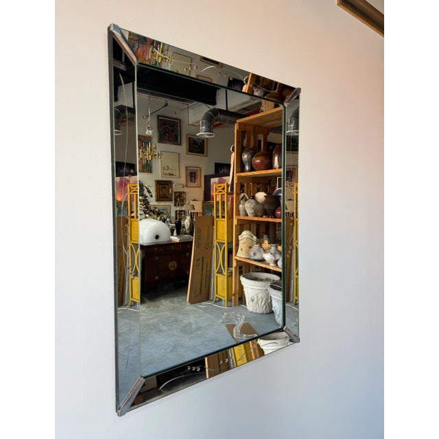 Available for sale is a striking 1960’s Hollywood Regency Venetian-style wall mirror, beautifully detailed with etched...