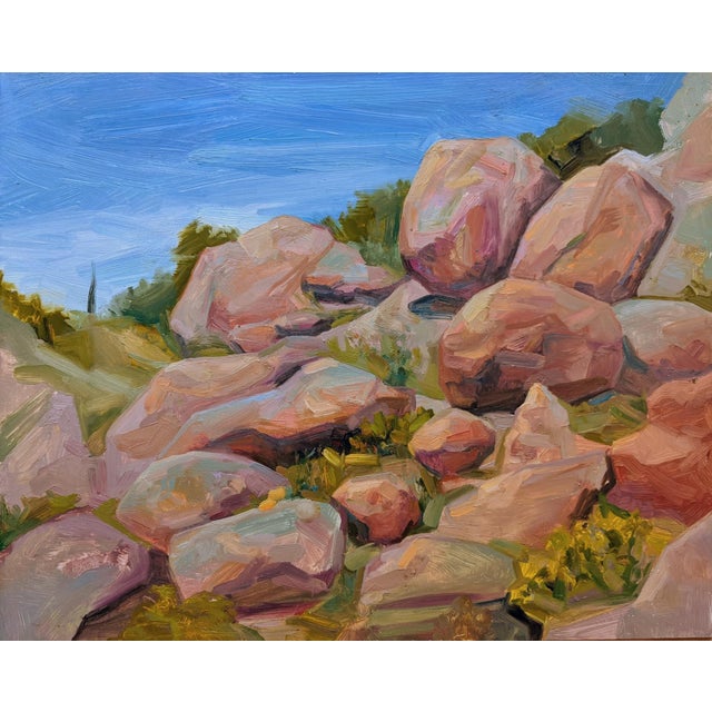 In "Rocky Forms," a vibrant landscape unfolds, showcasing an array of textured boulders bathed in warm hues of pink and...