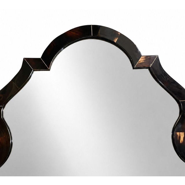 A dramatic large-scale Chippendale-style wall mirror designed by Karl Springer, American, circa 1980s. Springer...