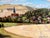 A penciled note “Biene vue generale” on the wooden stretcher bar verso leads the viewer to Beine, a charming wine-...