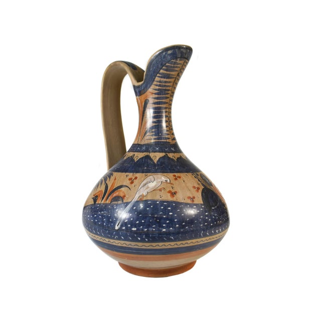 Stunnign hand crafted water jug originates from Tonala (Jalisco region) in Mexico. Tonala pottery is traditionally famous...