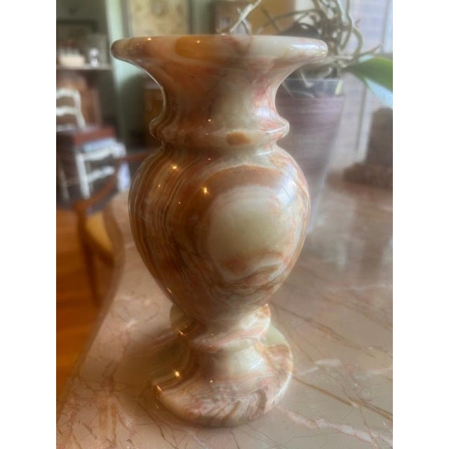 This is a decorative vase carved from natural banded stone, commonly referred to in the trade as onyx marble. It features...