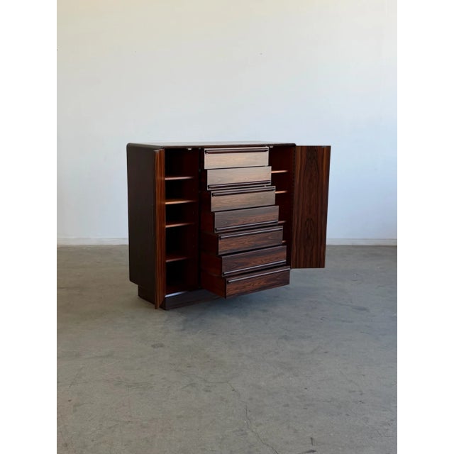 W48 D18.25 H44.5 Striking mid-century modern cabinet in richly grained rosewood, fully refinished to highlight the...