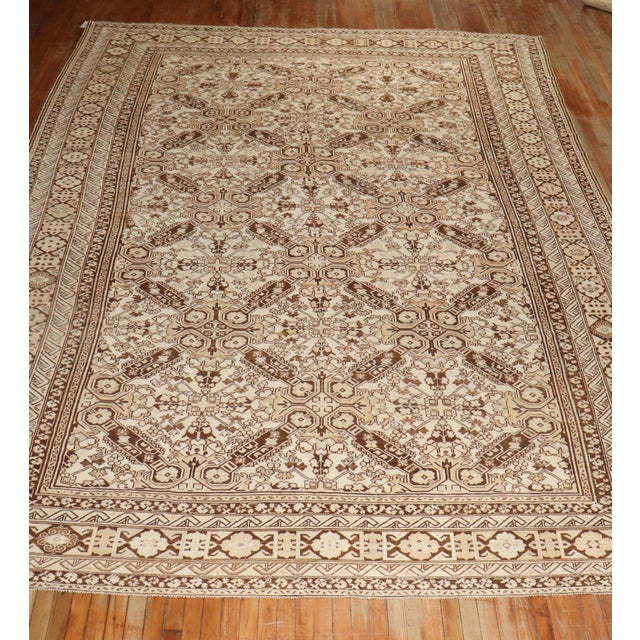 early 20th Kurd rug in ivory, brown and peach tones with a keyhole design you sometimes find in smaller tribal caucasian...