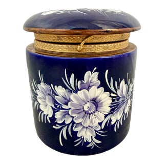 Vintage Keramos Italian Capodimonte Style Cobalt Blue Porcelain Dresser Vanity Jar With Purple & White Enameled Flowers & a Gilt Hinged Lid For Sale