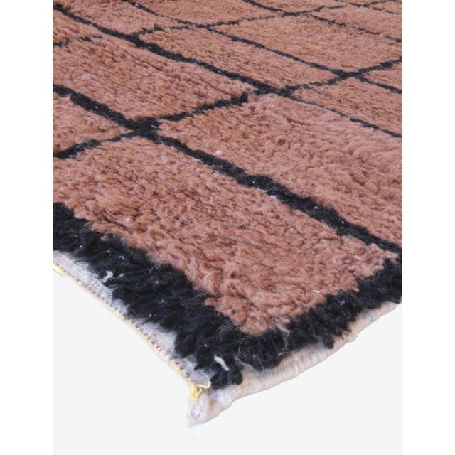 Bring warmth and character to your space with this handwoven Brown Moroccan Rug. Measuring 8.4 by 7 feet, its rich earthy...