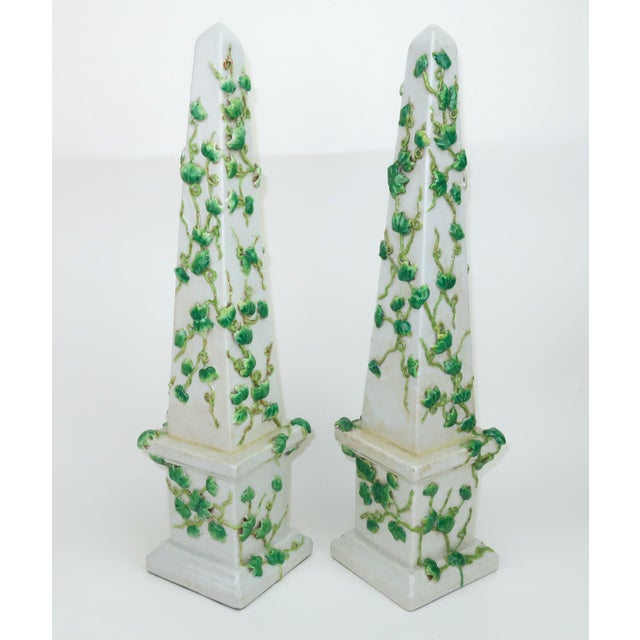 It's time for a garden party! Pair of tall C.1980 off-white Chinese ceramic obelisks with hand applied ivy vines in...