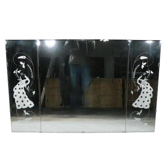 Voguish, chic, and stylish MCM, Art Deco, Hollywood Regency style mirror having a rectangular center panel, flanked by two...