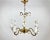 Rare vintage chandelier with 5 arms and a pair of wall sconces. Made of brass and art porcelain. Made in italy. Its design...