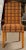 Set of four Palecek Wicker side chairs. Each having a yew color leg leading to a solid wicker tweed decorated seat and back.
