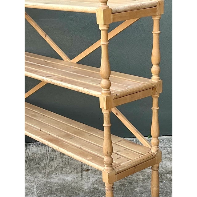 Crafted from pine, this vintage three-tier shelf brings rustic warmth and practical display space to an interior. Its...