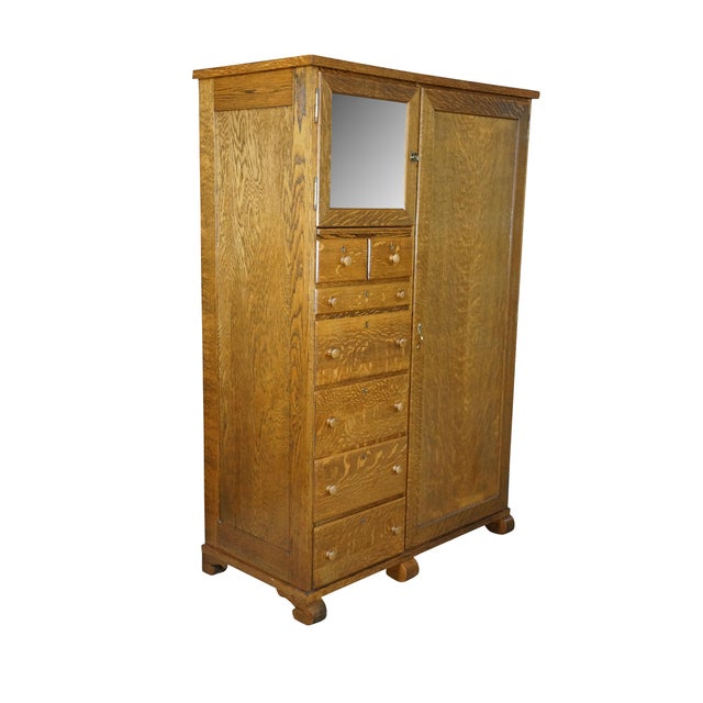 This exceptional antique American chifferobe wardrobe, dating from the 1910s to the 1920s, is a masterclass in early 20th-...