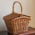 A charming mid-century wicker picnic basket with a peaked lid that opens on both sides. This basket features an intricate...