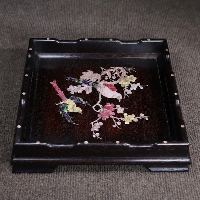 This is an exquisitely crafted square wooden tray featuring intricate mother-of-pearl (nacre) inlay work. Crafted from a...