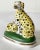 A wonderful pair of black and yellow dalmatians on a painted green base. These are 18th century Chelsea porcelain. They...