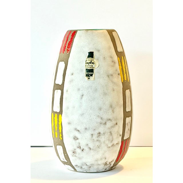 This is a totally rad Mid Century Modern hand painted West German pottery vase by JASBO Keramics. Its design and colors...