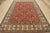 A tribal Caucasian Kazak rug hand-knotted with an all-wool pile on a cotton foundation. This oriental rug features an all-...