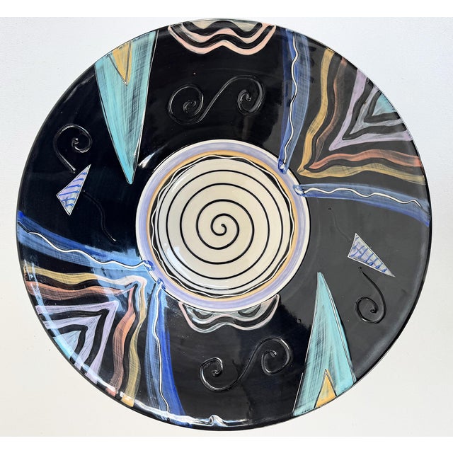 Offered for sale is a large studio pottery ceramic bowl finished in post-modern designs and colors. This oversale bowl has...