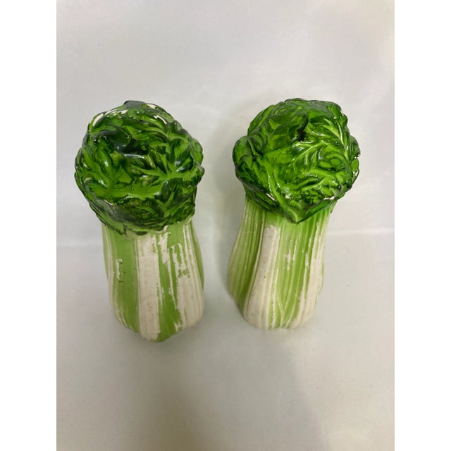 Add a unique flair to your dining collection with these vintage ceramic lettuce salt shakers. Featuring vibrant green tops...