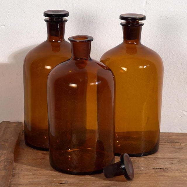 Glass jars with antique lids (c.1920) Style: French Provincial Materials and techniques: Glass Place of origin: France...