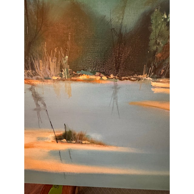 A quiet village, still water, and the last warm light along the shore. This atmospheric landscape is by French painter...