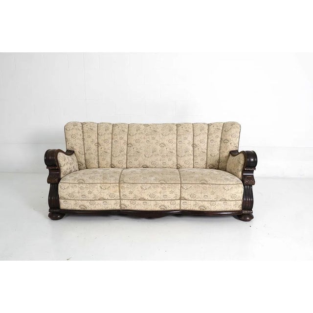 A solid testament to Scandinavian art deco design. This channel back sofa brings a substantial presence to any space with...