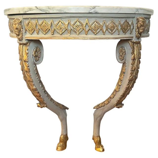 Pair of Late 18th Century Scandinavian Demi-lune Console Tables. Parcel Gilt with carved ram heads and hoof feet....
