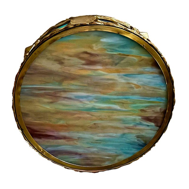 Antique plafonnier having round decorative brass frame with slag glass insets and raised bosses with bottom polychrome...