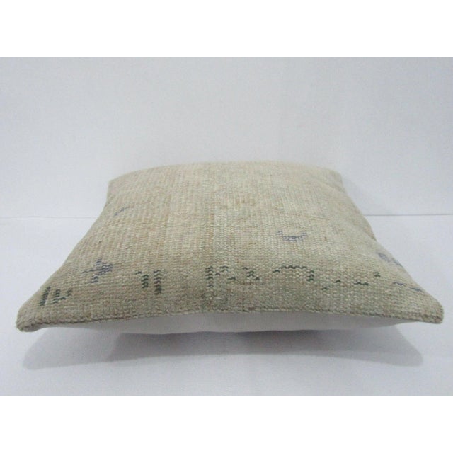 Decorative pillow cover made from a vintage Turkish handknotted rug. Backed with good quality cotton fabric. Pillow...