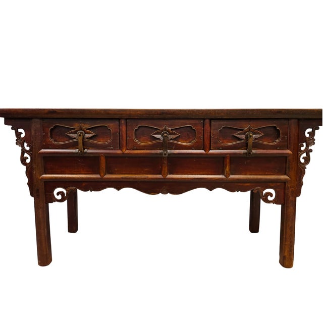 This antique 19th century console table is a traditional three-drawer altar coffer made from solid elm wood from the...