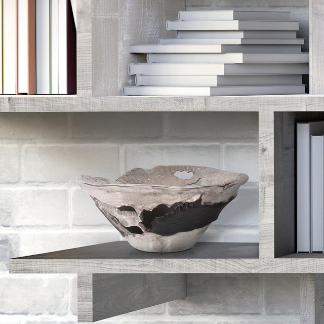 This contemporary flared bowl is a play on abstract, deconstructed design. Fashioned from aluminum, it has a raw, hand...