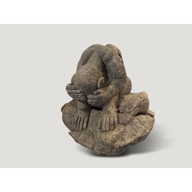 A praying Buddha hand carved from a single piece of wood. Circa 1930 This antique praying Buddha was sourced in the spirit...