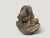 A praying Buddha hand carved from a single piece of wood. Circa 1930 This antique praying Buddha was sourced in the spirit...