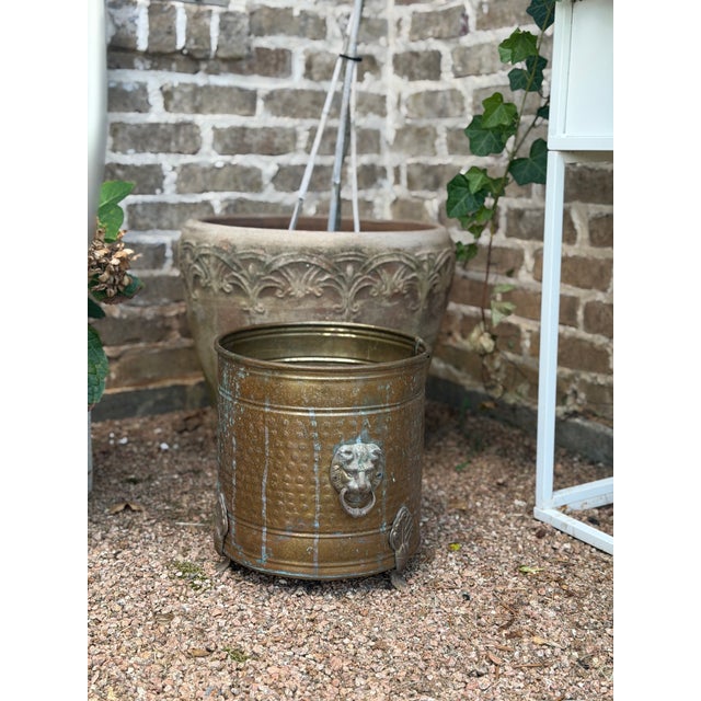 Decorative Metal planter adorned with classical lion motif. These antique planters were widely used in Victorian and...